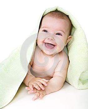 Happy baby with towel