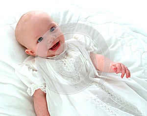 Happy Baby in White Dress