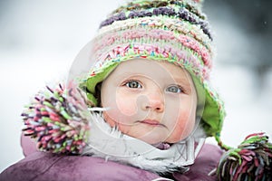 Happy baby on the winter background