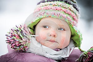 Happy baby on the winter background