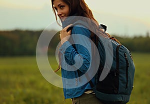 Happy backpacking adventurous woman have a trip with blue huge h photo
