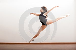 Happy ballet dancer jumping