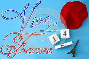 Happy Bastille day, long live France and French national day concept with a flat lay image of red beret, a block calendar set on photo