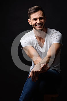 Happy bearded guy isolated on black