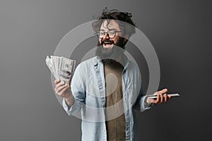Happy Bearded Man Holding Cash with Excitement