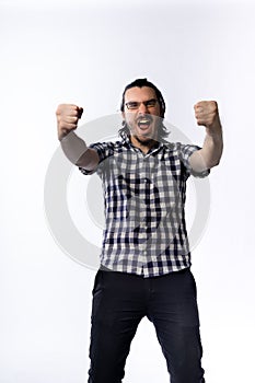 Happy bearded man raising his hands showing victory gesture