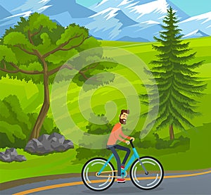 Happy bearded man riding bicycle on road near green trees, hills at snowy mountains background