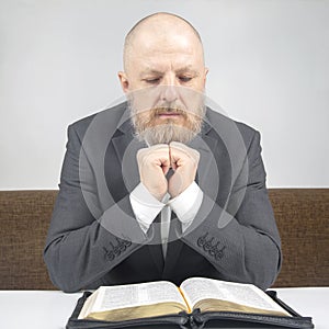 Happy bearded man studies the Bible. religion and Christianity