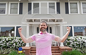 happy bearded man tenant near new house after rent or buy new home, tenancy