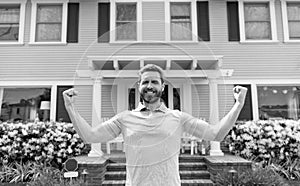 happy bearded man tenant near new house after rent or buy new home, tenancy