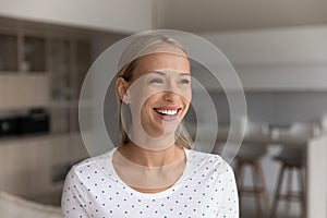 Happy beautiful 30s blonde woman home head shot portrait