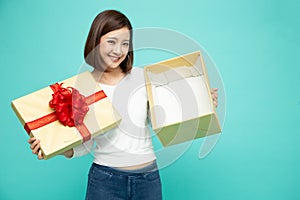 Happy beautiful asian woman smile and holding gift box isolated on white background.