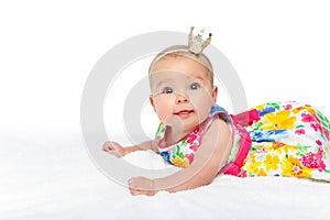 Happy beautiful baby girl with crown on head