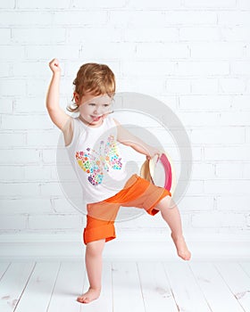 Happy beautiful baby girl dancer dancing hip hop dance