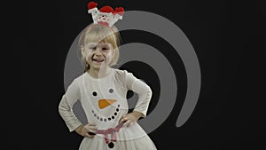 Happy beautiful baby girl in snowman costume. Christmas. Make faces, dance