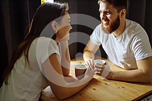 Happy beautiful couple drink tea in the morning