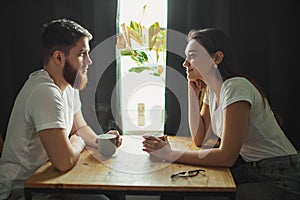 Happy beautiful couple drink tea in the morning