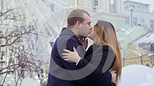 Happy beautiful couple kisses and celebrates engagement