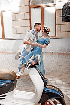 Happy beautiful couple kissing in european city in summer day