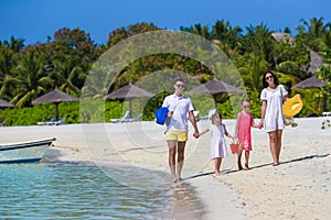 Happy beautiful family on a tropical beach holiday