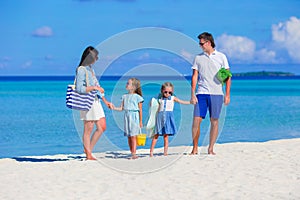 Happy beautiful family on a tropical beach holiday