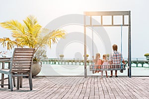 Happy beautiful family on a tropical beach vacation