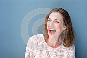 Happy beautiful fresh mid adult woman laughing