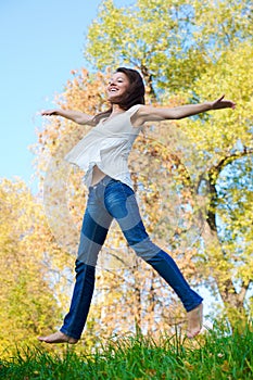 Happy beautiful girl jumping