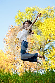 Happy beautiful girl jumping