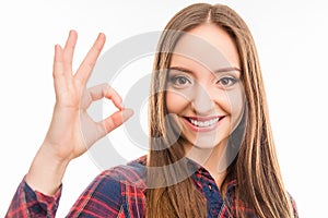 Happy beautiful girl showing gesture ok and smiling