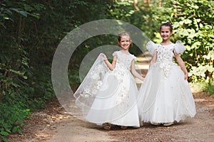 Happy beautiful girls with white wedding dresses