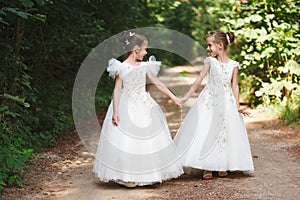 Happy beautiful girls with white wedding dresses