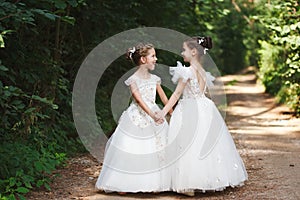 Happy beautiful girls with white wedding dresses