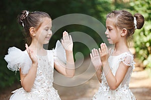 Happy beautiful girls with white wedding dresses