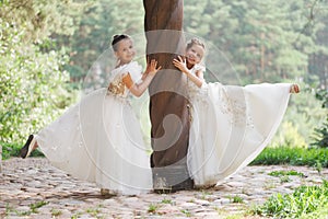 Happy beautiful girls with white wedding dresses