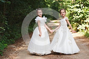 Happy beautiful girls with white wedding dresses