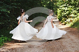 Happy beautiful girls with white wedding dresses