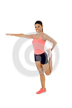 Happy beautiful latin woman stretching body muscles doing fitness workout