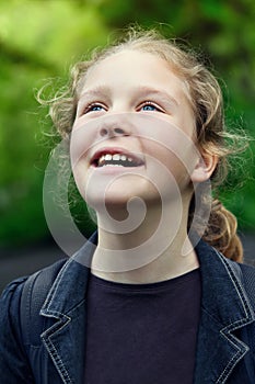 Happy beautiful little girl outdoors