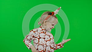 Happy beautiful little girl in a shirt with a Santa Claus. Christmas. Chroma Key