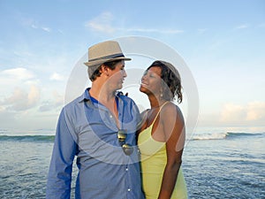 Happy and beautiful mixed ethnicity couple with beautiful afro American woman and cheerful Caucasian man enjoying holidays