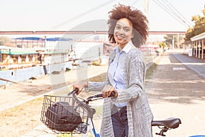Happy And Beautiful Mixed Race Black Woman Ride Bicycle
