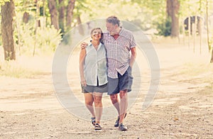 Happy senior couple walking and enjoying life outdoors