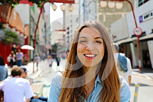 Happy beautiful smiling girl walking in Sao Paulo japanese neighborhood Liberdade, Sao Paulo, Brazil photo