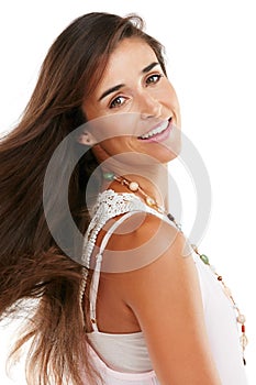 So happy, so beautiful. Studio portrait of an attractive young woman posing confidently against a white background.