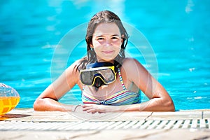 happy beautiful teen girl smiling at the pool