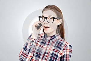 Happy beautiful teenage girl talking on mobile phone