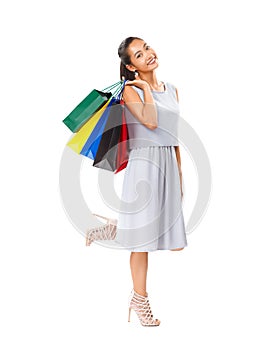 Happy beautiful woman holding many colorful shopping bags