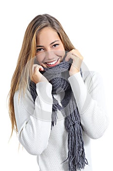 Happy beautiful woman keeping warm in a sweater in a cold winter