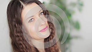 Happy beautiful woman smiling, perfect white teeth smile, curly hairstyle as natural beauty face portrait of caucasian